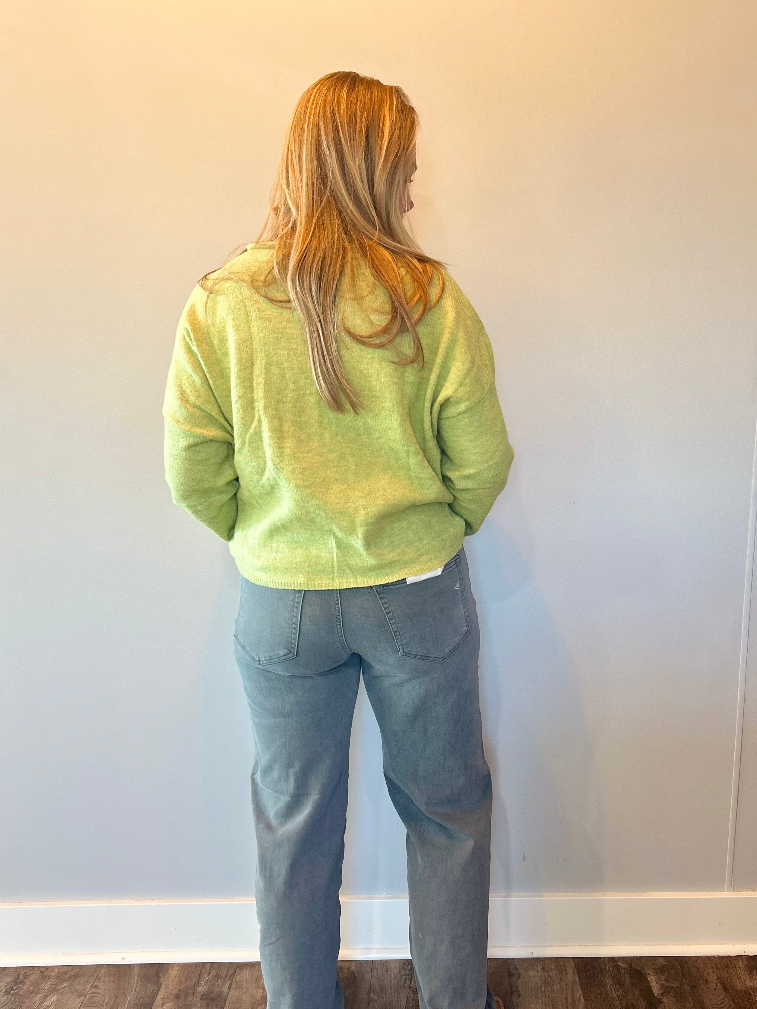 Detail of the mid to high rise waistband and belt loops on the charcoal dad jeans