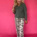 Back view of the green Medina pointelle cardigan showing the relaxed drape and ribbed trim