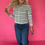 Close-up of the raw hem edge on the medium dark Curator wash stretch denim of the wide leg jeans