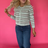 Close-up of the raw hem edge on the medium dark Curator wash stretch denim of the wide leg jeans