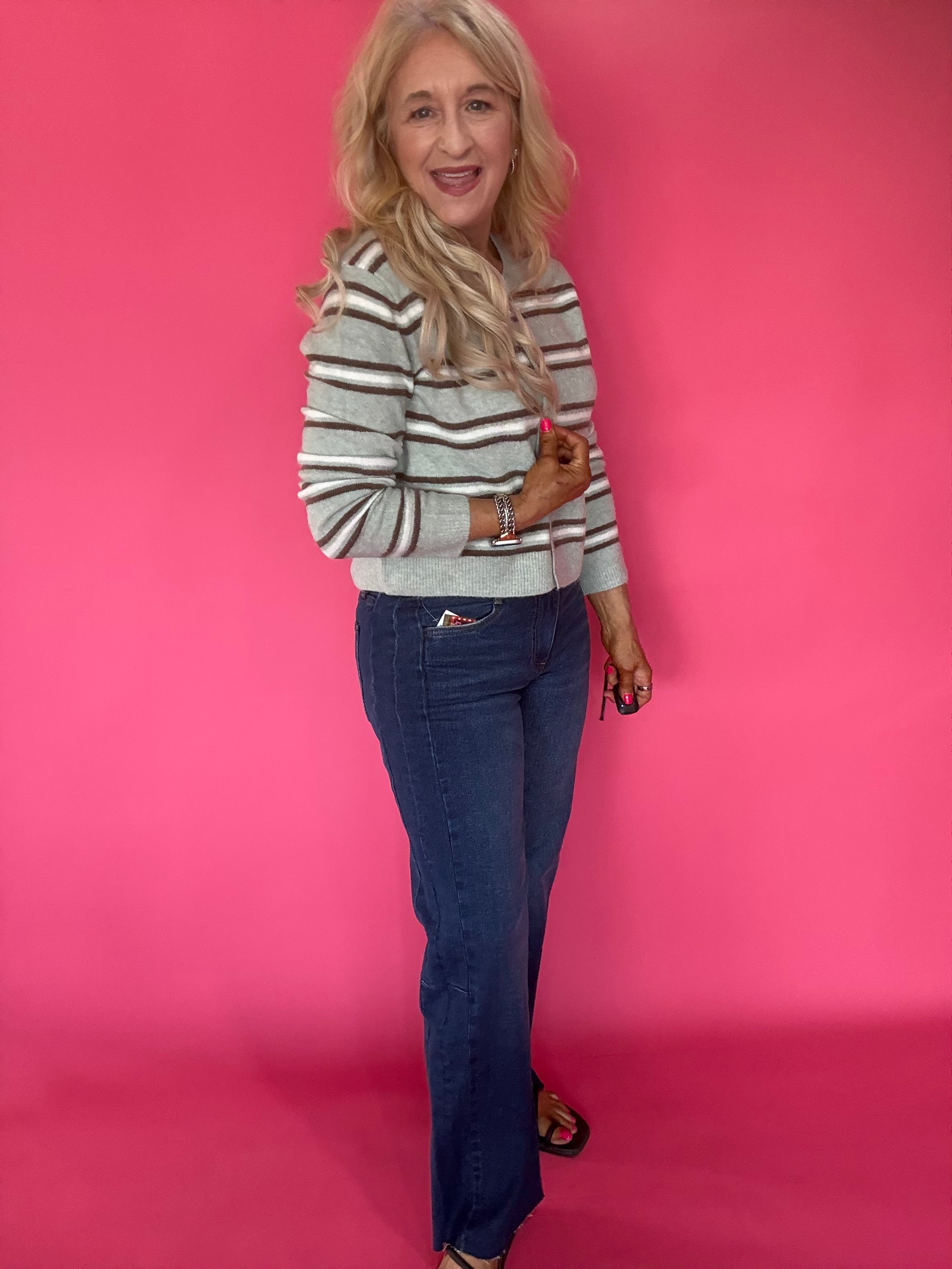 Detail of the Fab Ab front pockets smoothing the mid rise waist on the wide leg jeans