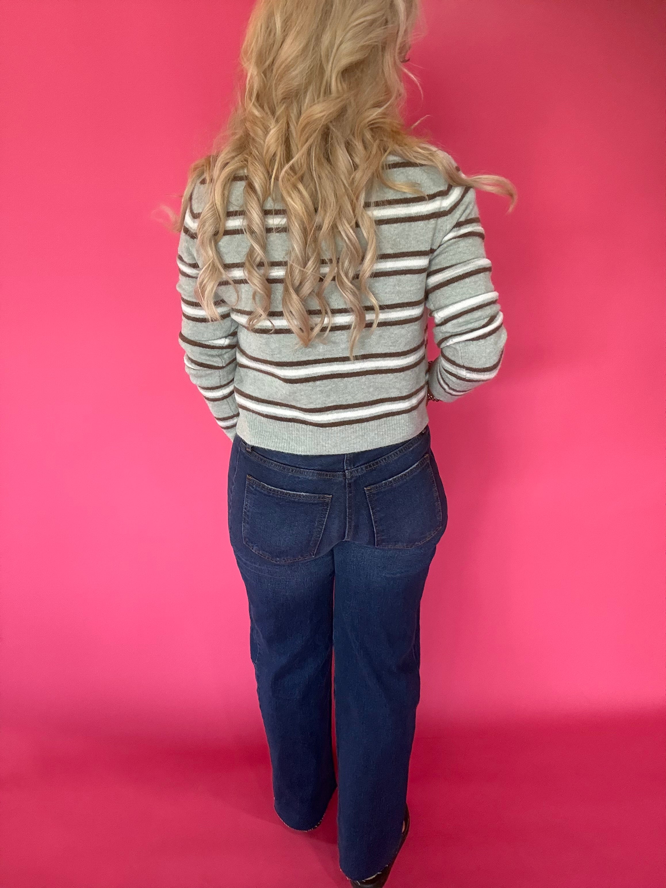 Full outfit view of the aqua striped button front cardigan styled with wide leg denim
