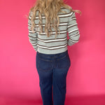 Full outfit view of the aqua striped button front cardigan styled with wide leg denim