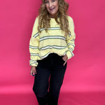 Close-up of the wide roll up hem cuff at the ankle on the black high rise wide leg jeans