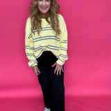 Back view of the black wide leg jeans showing the high rise waist and roomy 21 inch leg opening