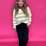 Flat lay of the black wide leg jeans showing the wide roll up hem and double front pockets