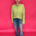 Back view of the determin wash straight leg jeans showing simple back pockets and a long inseam