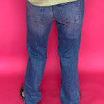 Detail of the 11 inch high rise waistband and button closure on the straight leg denim