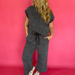 Side view of the polka dot scuba lounge set showing the wide leg cropped pant silhouette