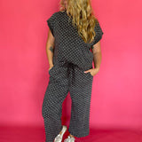 Side view of the polka dot scuba lounge set showing the wide leg cropped pant silhouette