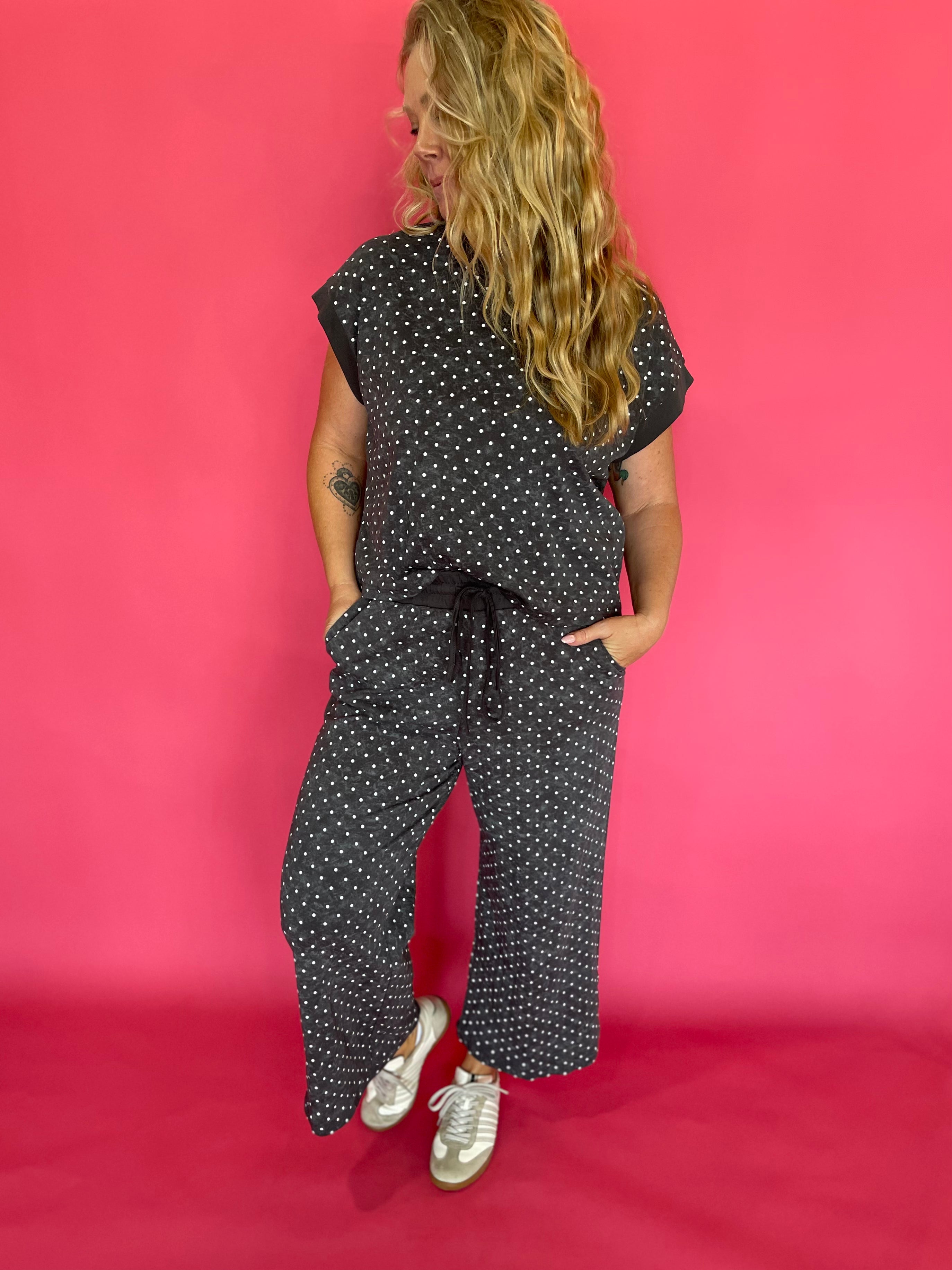 Side view of the polka dot scuba lounge set showing the wide leg cropped pant silhouette