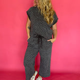 Side view of the polka dot scuba lounge set showing the wide leg cropped pant silhouette