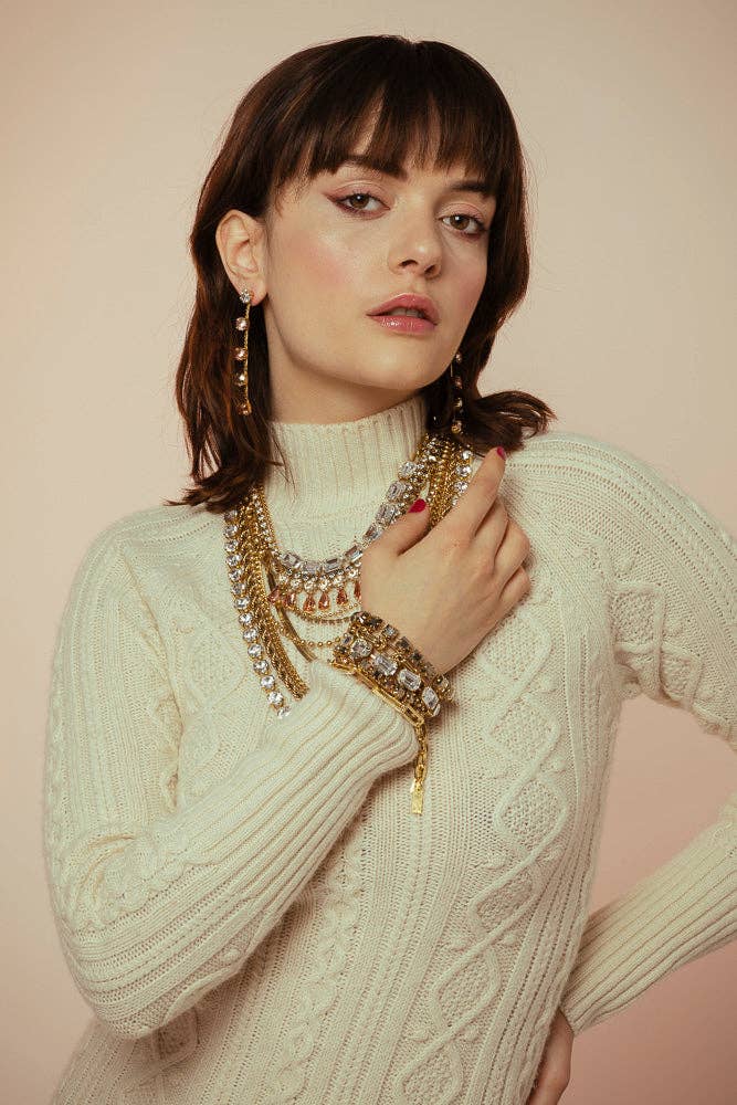 Close-up of the clear crystal line and antique gold setting on the Monique bracelet