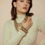 Close-up of the clear crystal line and antique gold setting on the Monique bracelet