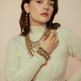 Close-up of the clear crystal line and antique gold setting on the Monique bracelet