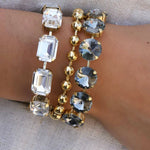 Flat lay of the clear crystal Monique bracelet laid open flat on a neutral background
