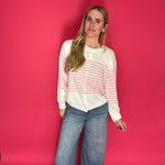 Detail of the front fly zipper and button closure at the high rise of the wide leg trouser jeans