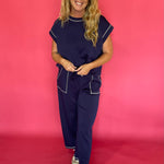 Back view of the navy scuba lounge set showing the relaxed top and wide leg pant drape