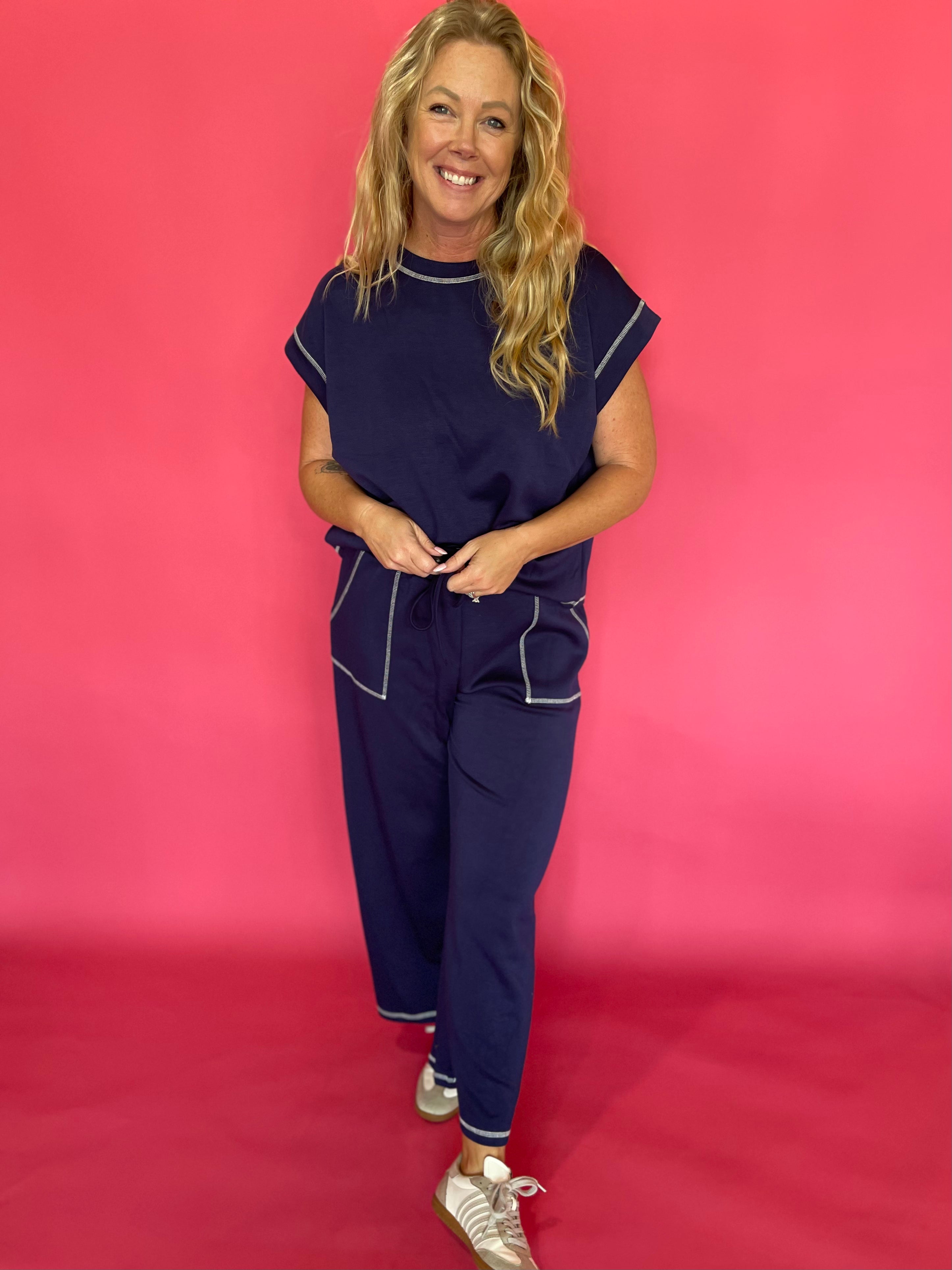 Back view of the navy scuba lounge set showing the relaxed top and wide leg pant drape