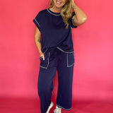 Side view of the navy lounge set showing the side pocket and elastic drawstring waist