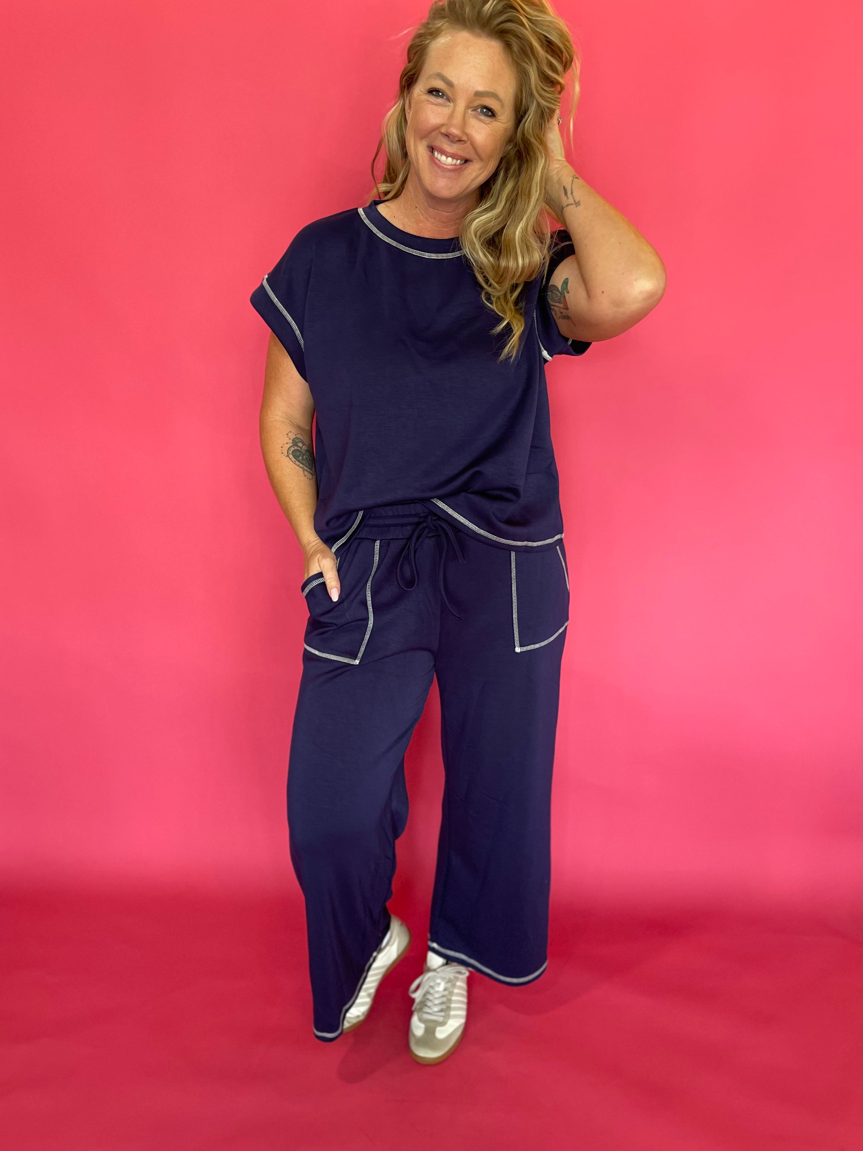 Side view of the navy lounge set showing the side pocket and elastic drawstring waist