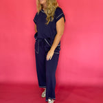 Full length view of the navy scuba lounge set with the cap sleeve top and wide leg pants