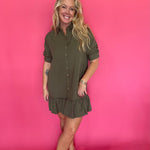 Close-up of the collar, button placket, and chest pocket on the olive shirt dress