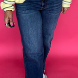 Woman wearing high rise straight leg jeans with a clean hem and a tucked in tee for everyday wear