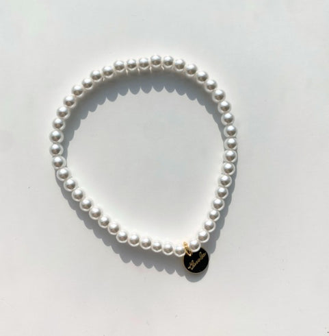 Single strand of small faux pearls on an elastic stretch bracelet that fits most wrists