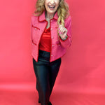 Back view of the pink embroidered tweed jacket showing its tailored long sleeve silhouette