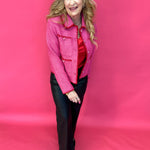Woman styling the pink tweed jacket over denim and a simple tank with neutral heels