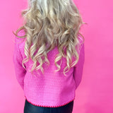 Flat lay of the fuchsia embroidered tweed jacket showing the button front and lined interior