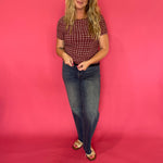 Side view showing the lettuce edge trim at the sleeve and hem of the gingham texture top