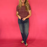 Side view showing the lettuce edge trim at the sleeve and hem of the gingham texture top