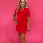 Back view of the red tie neck dress showing the easy flowy fit