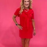 Side view showing the drape and length of the red short sleeve dress