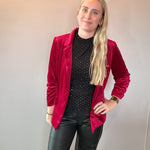Back view of the red velvet blazer showing the tailored silhouette and smooth lining