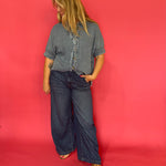 Back view of the mineral wash denim button-up showing its easy relaxed fit through the body