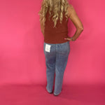 Flat lay of the rust ribbed sweater knit tank showing the neckline and shoulder width