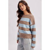 Close-up of the rolled boat neckline on the brown and sky blue striped soft knit sweater