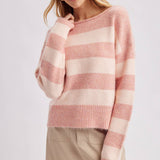 Detail of the ribbed hem along the bottom of the brown and sky blue striped boatneck sweater