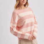 Close-up of the horizontal stripe pattern in brown and sky blue on the cozy knit sweater