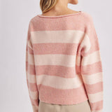 Three quarter view of the brown and sky striped boatneck sweater styled for a casual weekend