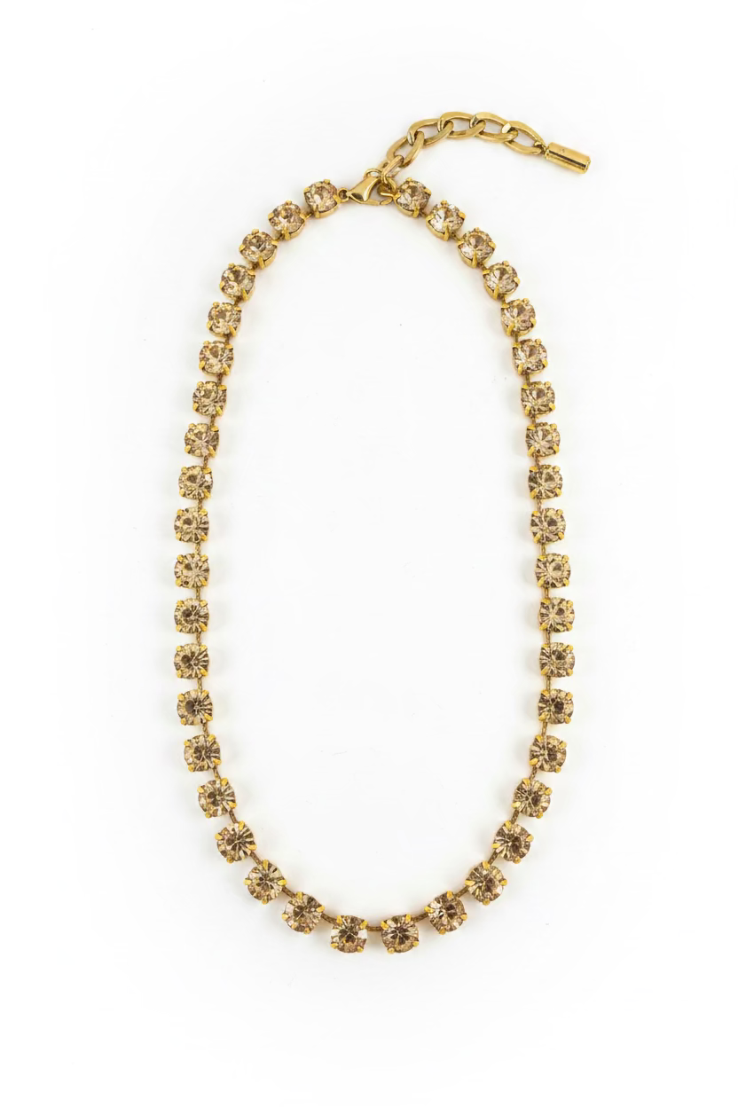 Sarina necklace in clear with 6mm faceted crystals strung along an antique gold plated chain