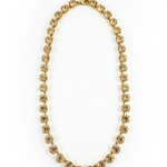 Sarina necklace in clear with 6mm faceted crystals strung along an antique gold plated chain