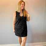 Back view of the black sequin mini dress showing the button closure at the back