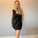Close-up of the beaded neckline and front keyhole on the sequin dress