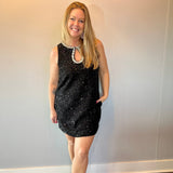 Close-up of the beaded neckline and front keyhole on the sequin dress