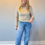 Back view of the medium wash straight jeans showing five pocket styling and a relaxed leg
