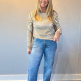 Back view of the medium wash straight jeans showing five pocket styling and a relaxed leg